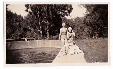 A black and white photograph taken at Mary Lodge Guest House in Marysville. The photograph is of a group of two unknown ladies by the edge of the swimming pool at Mary Lodge. The photograph was taken in 1941.