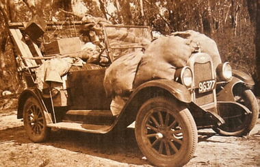 A digital copy of a black and white photograph of Walter Chester's car loaded up with supplies.
