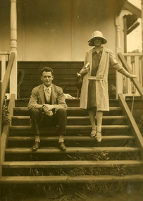 A copy of a black and white photograph of Arnold and Gladys Emandsen, guests who were staying at Kooringa guest house in Marysville. The original house was built in 1914 for Frederick Webb by the Cuzens Brothers. The original photograph was taken in 1934. 