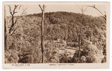 A black and white postcard from Kooringa Guesthouse in Marysville. The original house was built in 1914 for Frederick Webb by the Cuzens Brothers. The postcard was produced by The Rose Stereograph Co. as a souvenir of Marysville. On the reverse is a hand written message.