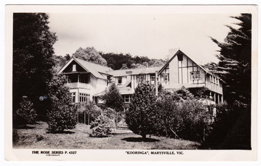 A black and white postcard from Kooringa Guesthouse in Marysville. The original house was built in 1914 for Frederick Webb by the Cuzens Brothers. The postcard was produced by the Rose Stereograph Co. as a souvenir of Marysville. On the reverse is a space to write a message and an address and to place a postage stamp. The postcard is unused.