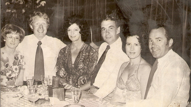 A copy of a black and white photograph of Barry and Kathy Brenton, the owners of Kooringa Guest House, with two couples sitting at a dinner table. The two couples are unknown.
