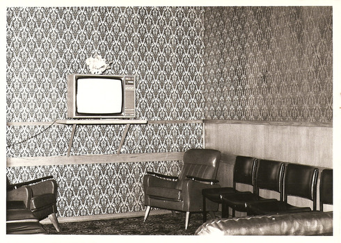 A copy of a black and white photograph taken at Kooringa Tourist House in Marysville. The photograph is of the lounge/television area.
