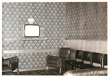A copy of a black and white photograph taken at Kooringa Tourist House in Marysville. The photograph is of the lounge/television area.