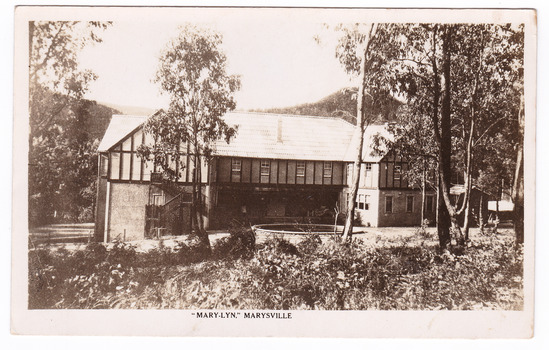 A black and white postcard from Marylyn Guest House in Marysville. Marylyn was a part of the Mary Chain of guest houses built by Eric Dowdle in the Depression years. The postcard was produced by the Rose Stereograph Company as a souvenir of Marysville. On the reverse is a hand-written message.
