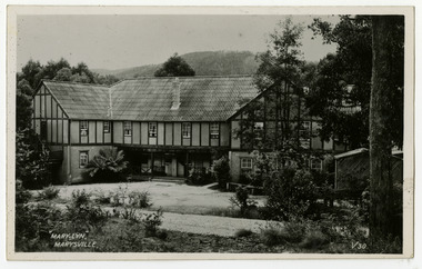 A black and white postcard from Mary-Lyn Guest House in Marysville. Mary-Lyn was a part of the Mary Chain of guest houses built by Eric Dowdle in the Depression years. The postcard was produced by Valentine Publishing Co. Pty. Ltd. as a souvenir of Marysville. On the reverse of the postcard is a space to write a message and to place a postage stamp. The postcard is unused.