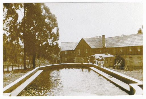 A copy of a black and white photograph taken at Mary-Lyn Guest House in Marysville. Mary Lyn was a part of the Mary Chain of guest houses built by Eric Dowdle in the Depression years. The original photograph was taken in January 1940 and shows a view of the swimming pool at Mary-Lyn.