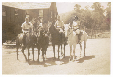 A copy of a black and white photograph taken at Mary-Lyn Guest House in Marysville. Mary Lyn was a part of the Mary Chain of guest houses built by Eric Dowdle in the Depression years. The original photograph was taken in January 1940 and shows a view of a group of riders on horseback.