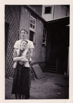 A black and white photograph taken at Mary-Lyn Guest House in Marysville. Mary-Lyn was a part of the Mary Chain of guest houses built by Eric Dowdle in the Depression years. The photograph is of a young man and and lady who worked at Mary-Lyn.
