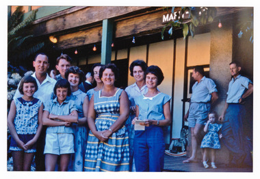 A copy of a colour photograph taken at Mary-Lyn Guest House in Marysville. Mary-Lyn was a part of the Mary Chain of guest houses built by Eric Dowdle in the Depression years. The photograph was taken on January 14th 1962 and shows a group of guests staying at Mary-Lyn.