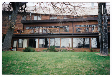 A colour photograph taken at Mary-Lyn Guest House in Marysville. Mary-Lyn was a part of the Mary Chain of guest houses built by Eric Dowdle during the Depression years. The photograph shows the view of the rear of the main building at Mary-Lyn.