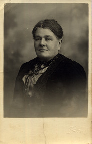 A copy of a black and white photograph of Sarah Lawlor of Buxton. William and Sarah Lawlor were pioneers in Buxton and farmed there from 1904 for approximately 20 years.