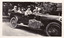 Two black and white photographs of cars travelling along the Black Spur in the 1920s.