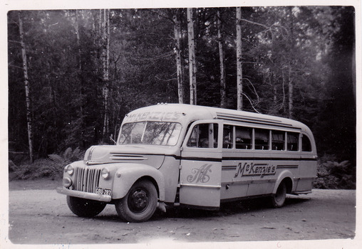 A black and white photograph of a McKenzie's Tourist Services bus. McKenzies Tourist Services were associated with the growth of Marysville as a tourist destination. The photograph was taken in 1954.