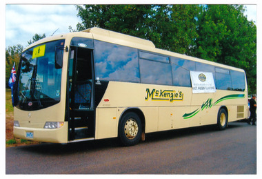 A colour photograph of a McKenzie's bus. McKenzie's Tourist Services were associated with the growth of Marysville as a tourist destination.