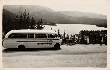 A black and white photograph of a McKenzie's Tourist Services bus at Maroondah Dam. McKenzie's Tourist Services were associated with the growth of Marysville as a tourist destination.