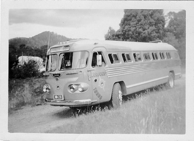 A digital copy of a black and white photograph of a Pioneer Tours bus in Marysville.