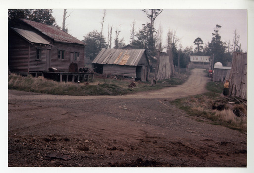 A copy of a colour photograph of the Cambarville timber mill in Victoria. Cambarville was established as a timber mill town in the 1940s. Timber mill owners A. Cameron and F.J. Barton named Cambarville. They established the mill to salvage timber from trees destroyed in the 1939 bushfires. Cambarville was impacted by the 2009 Black Saturday bushfires and any remaining structures were destroyed. The original photograph was taken in 1960.
