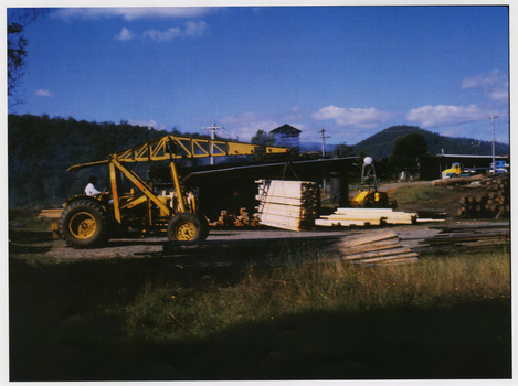 A copy of a colour photograph taken at Sunds Bros Sawmill located in Marysville. The original photograph was taken in the 1970s. Sund's Sawmill (historically operated by Arthur & John Sund and often referenced locally as Sund Stenco) was a prominent mid-century timber mill located in Marysville, Victoria. It played a central role in the region's booming post-war logging era. 