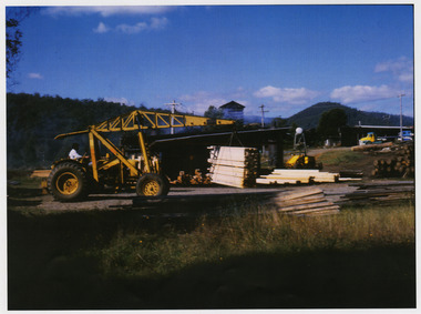 A copy of a colour photograph taken at Sunds Bros Sawmill located in Marysville. The original photograph was taken in the 1970s. Sund's Sawmill (historically operated by Arthur & John Sund and often referenced locally as Sund Stenco) was a prominent mid-century timber mill located in Marysville, Victoria. It played a central role in the region's booming post-war logging era. 
