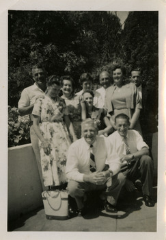 A black and white photograph of a group of men and ladies. Two of the men in the photograph worked at timber mills near Marysville.