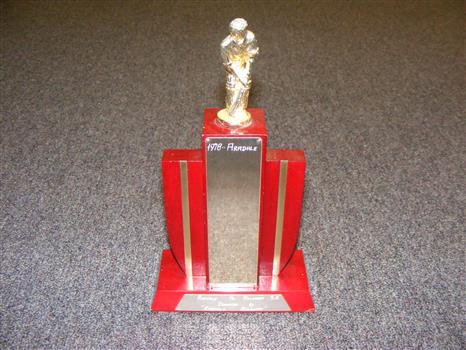 A cricket trophy with engraving Aradale 1978