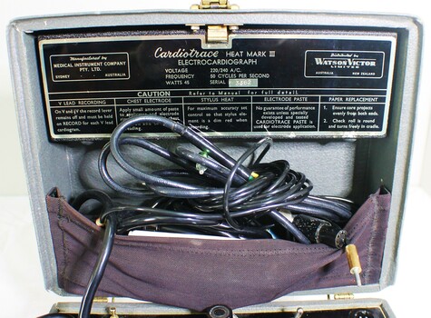 Under top cover of Electrocardiograph Machine showing hallmark plate and instructions