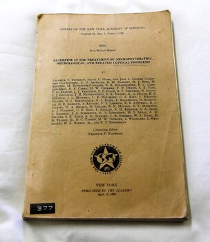 Front cover - Black print on tan background.