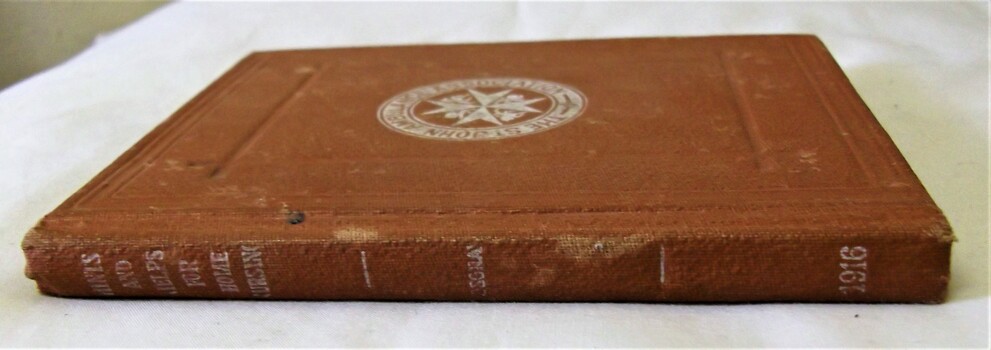Book spine. Leather bound hardback. Dark tan colour.