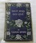 Blue paperboard cover with stencilled flowers and leaves 