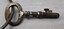 Metal key. Rust and scratches from wear and tear. 'J. Hubball' and 'Melbourne' engraved on bow.