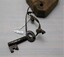 Closer view of key tied to wooden tag