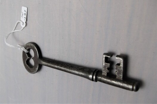 Old gaol key with dents and scratches