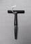 Metal T Bar Key with some wear and tear and A.W engraved on one side