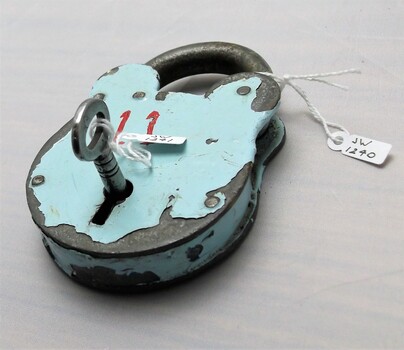 Gaol padlock and key with cracked enamel paint