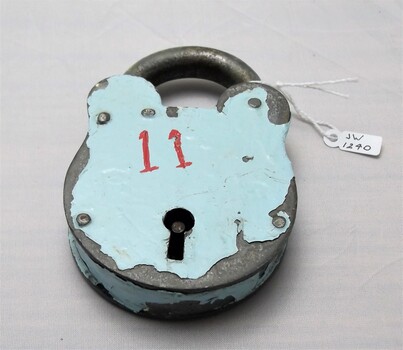 Gaol padlock with cracked blue enamel paint