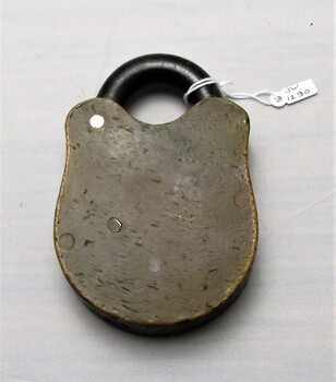 Back view of  gaol padlock with dents 