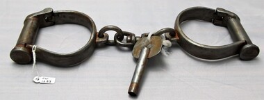 Front view of handcuffs with key