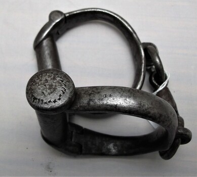 Right handcuff showing engravings