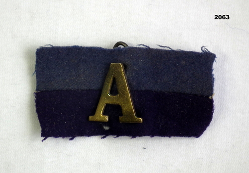 WW1 colour patch with A for ANZAC badge.