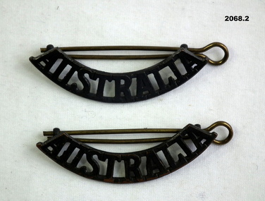 Two Australia shoulder uniform badges.