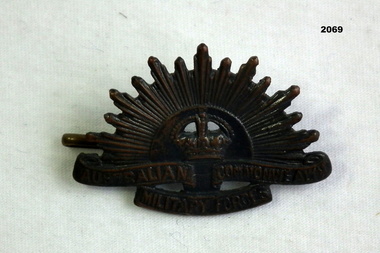 Rising sun lapel uniform badge