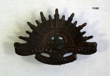 Rising sun lapel badge for uniform