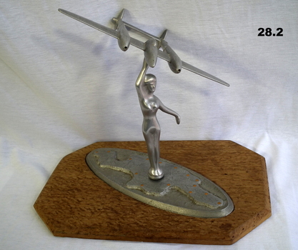 Trench art with female figure and aeroplane