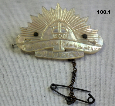 Three Trench art style brooches and badges