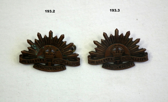 blackened rising sun collar badges. WW2