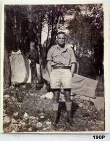B & W photo of a soldier in shorts WW2