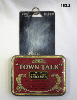 Shaving mirror and tobacco tin of a POW