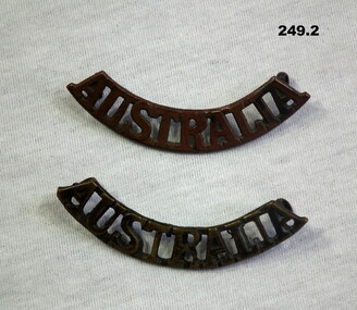 Blackened Australia shoulder badges WW2