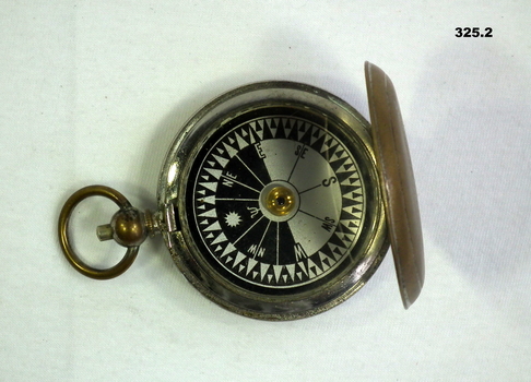 Compass enclosed with brass lid